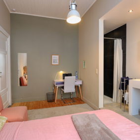 furnished pink bedroom with shower to rent in a shared space