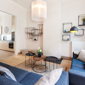 well-decorated living room in a coliving space close to different points of interest