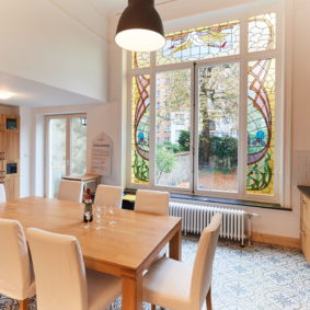 fully-equipped kitchen including oven and microwave and with magnificent original 19th century stained glass windows