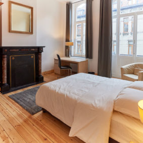 beatiful double bed room ancient style with wooden dressing in a shared house