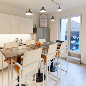 fully equipped kitchen with a design dining table in a fully refurbished house for expats in Brussels
