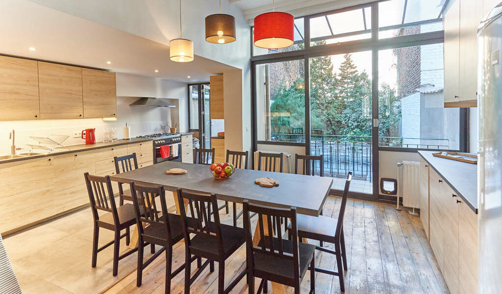 fully equipped kitchen with a design dining table in a fully refurbished house for expats close to the European Comission