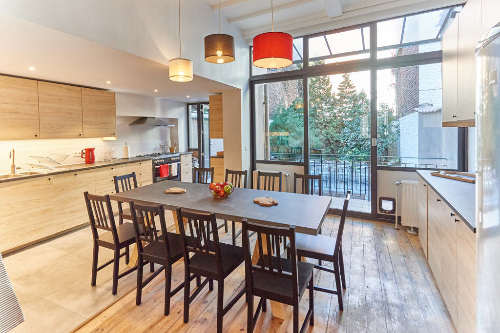 fully equipped kitchen with a design dining table in a fully refurbished house for expats close to the European Comission