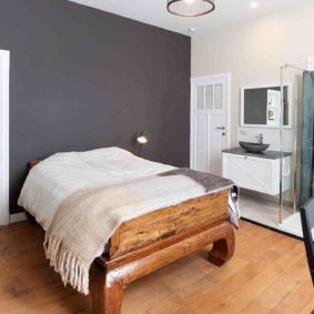 well-decorated bedroom with private shower in a shared house in Brussels