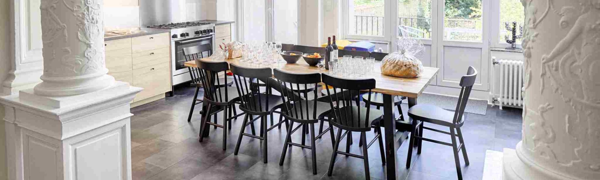 fully equipped kitchen with oven and microwave and stylish dining table in a cohousing space in Brussels