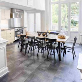 fully equipped kitchen with oven and microwave and stylish dining table in a cohousing space in Brussels