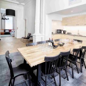 fully equipped kitchen with a design wooden dining table in a shared house in Brussels close to the European Commission