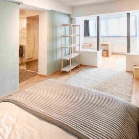 spacious room with double bed and a private shower in a fully refurbishedd share house for expats