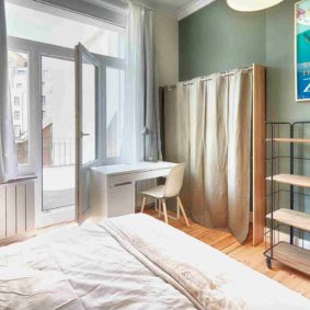 furnished bedroom designed with taste in a shard house for expats in Brussels