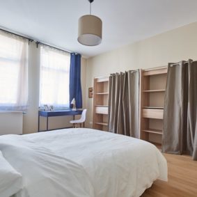 comfortable and furnished room including a dressing and a private shower in a coliving space for expats in Brussels