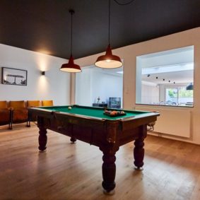 beautiful billiard table with chairs in a shared house for expats in Brussels close to the European Commission