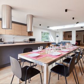 fully equipped kitchen with a design dining table in a shared house for expats in Brussels