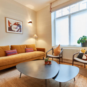 living room with design sofas in a fully renovated house sharing well-located in Ixelles