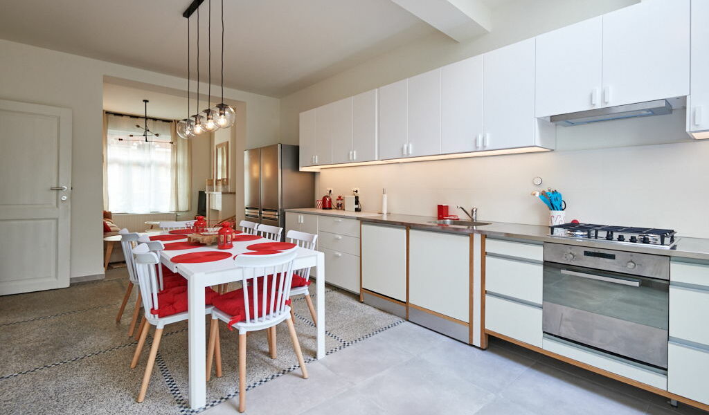 fully equipped kitchen with a design dining table in a fully refurbished house for expats close to the European Comission