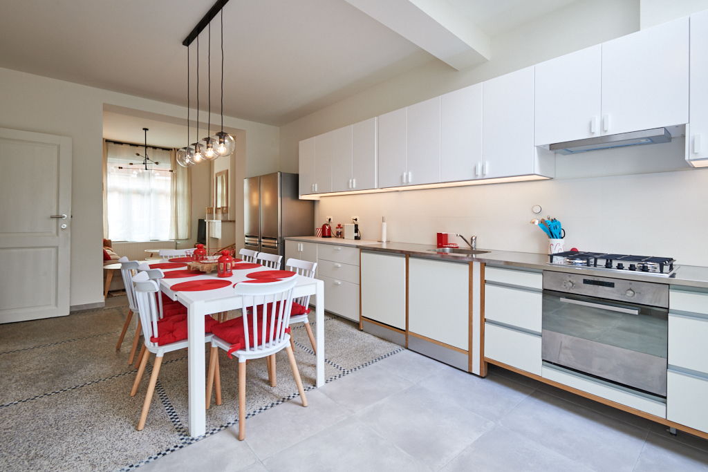 fully equipped kitchen with a design dining table in a fully refurbished house for expats close to the European Comission