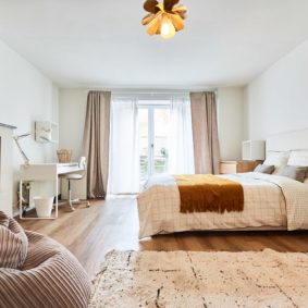 well-decorated room with large dressing and wooden floor and private bathroom, access to terrace in a coliving space in Brussels