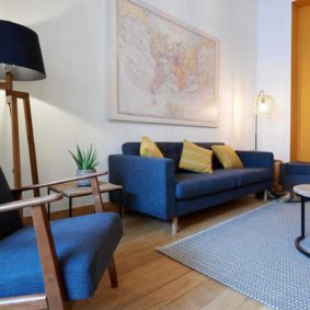 Fully furnished and well-decorated living room by a Belgian interior designer in a house located near Ambiorix Square