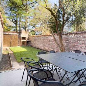 Spacious terrace and garden with barbeque and furniture for a community of young people working in Brussels