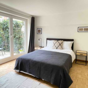 Fully furnished double bedroom with access to the garden and private shower room in a shared house in Brussels