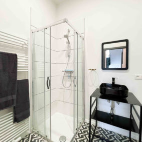 Private bathroom with shower and sink in coliving house in Brussels for internationals close to Cinquantenaire Park and points of interest