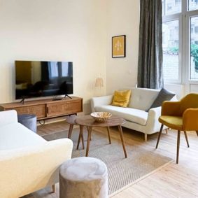 Cosy living room with nice sofas and a smart TV with high speed wifi