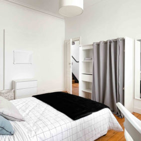Fully furnished bedroom in community driven cohousing