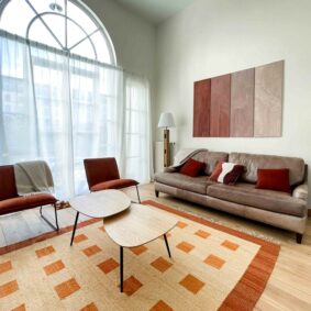 Spacious shared living room in Saint-Catherine-located coliving by ShareHomeBrussels
